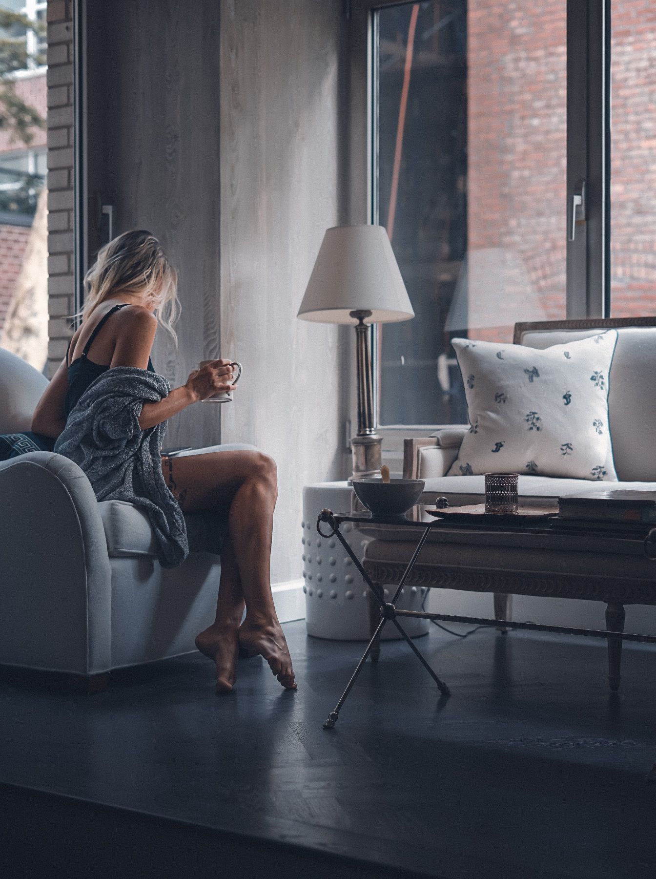 Luxury Real Estate Living Room with a Woman on the Sofa
